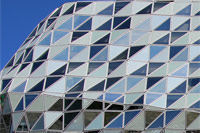 The glass facade of the Port House in Antwerp