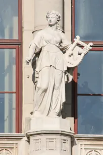 Statue of a muse on the facade of the Vigadó in Budapest