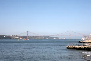 The 25th of April Bridge in Lisbon seen from Praça do Comércio
