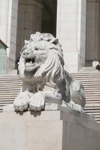 Lion statue at the foot of the staircase to the Sao Bento Palace in Lisbon