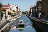 Cruise boat on the Naviglio Grande canal in Milan