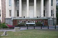 The St. Charles  streetcar in front of the Gallier Hall