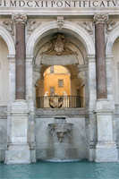Detail of the middle arch of the Fontana dell'Acqua Paola, Rome